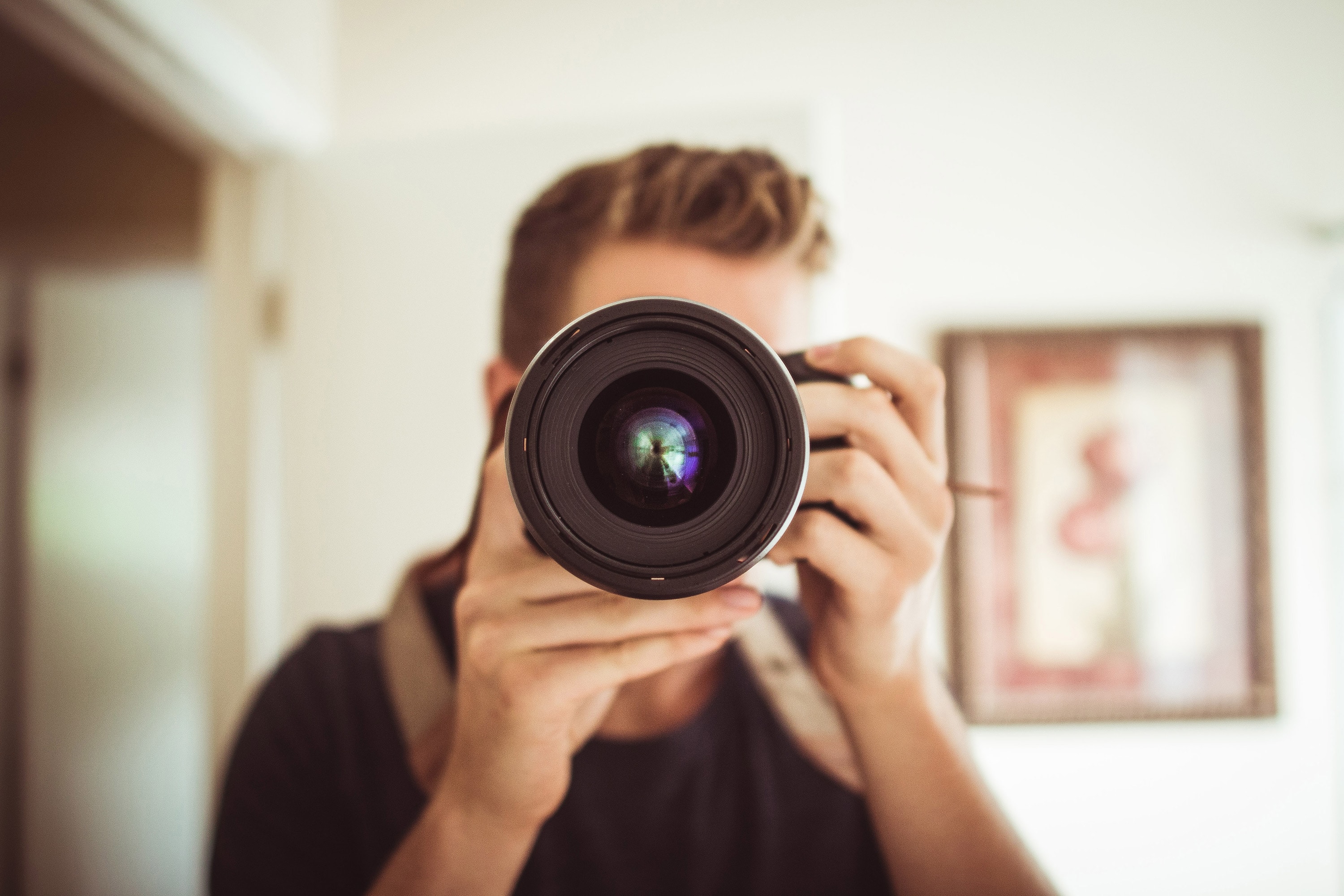 Photographer holding a camera at eye level